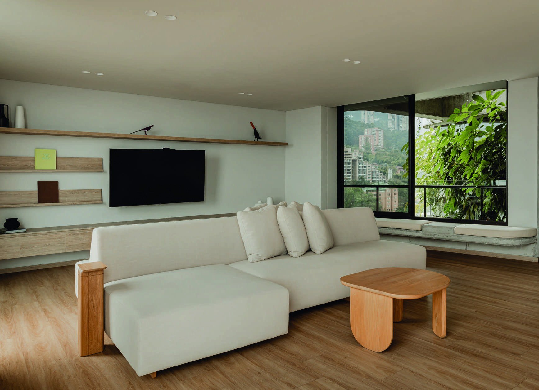 Living room of the suite with sofa and large windows