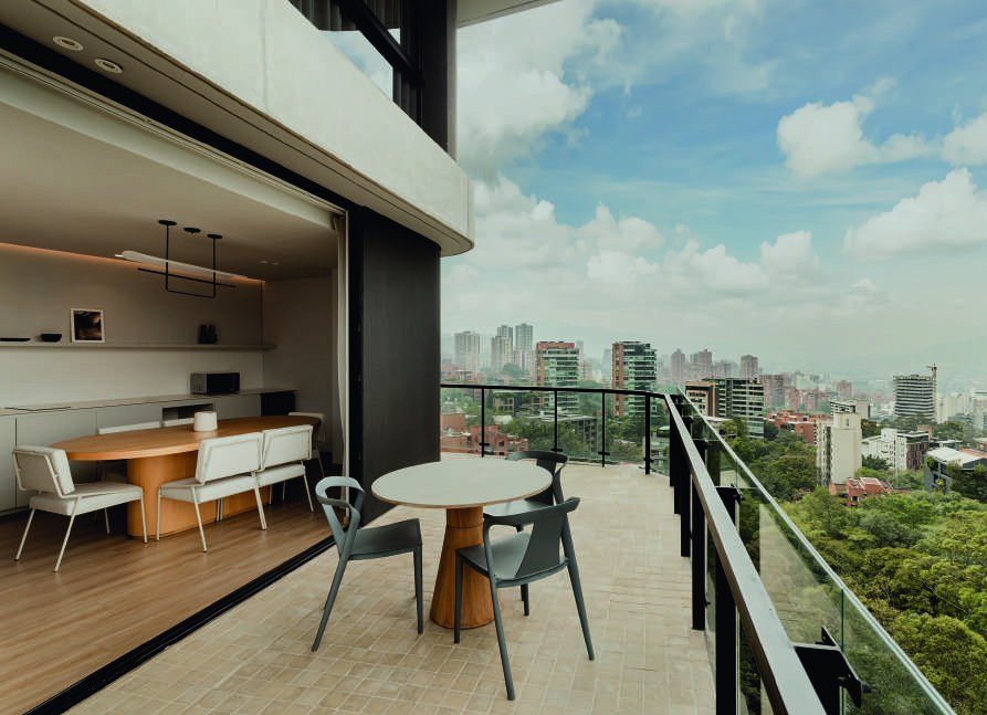 Dining room opening onto the terrace with city view